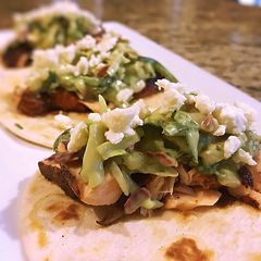 A picture of Blackened salmon tacos with Spicy Avocado pear slaw.