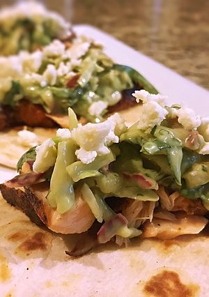 A picture of Blackened salmon tacos with Spicy Avocado pear slaw.