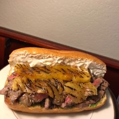 A picture of Rib Eye Pineapple and Pestomole Sandwich.
