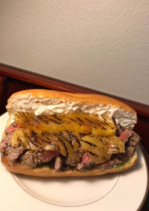 A picture of Rib Eye Pineapple and Pestomole Sandwich.