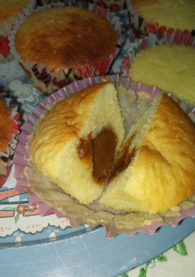 Una foto de Magdalenas con dulce de leche