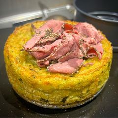 A picture of Colcannon with confit egg and peppered beef - Irish mash.