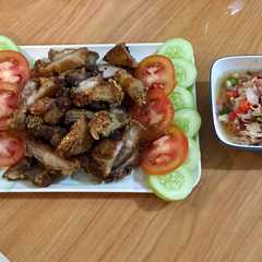 A picture of Babi Panggang Kriuukk with sambal matah.