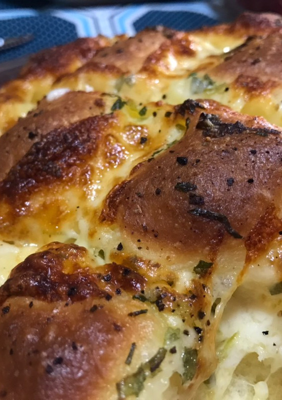 Una foto de Pan de ajo y queso