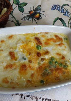 Una foto de Cazuelas horneadas de huevos con guisantes