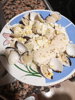 Una foto de Merluza con almejas