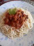 Cordero guisado en salsa de tomate