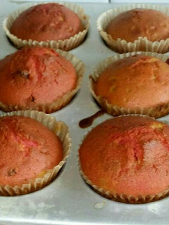 A picture of Mixed coloured cupcakes.