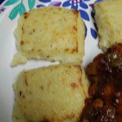 A picture of Rosemary Roman Polenta/Grits Cakes.