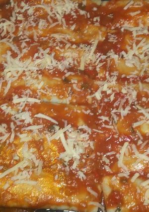 Una foto de Canelones de sabalo y espinaca