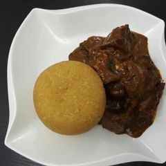 A picture of Ogbono soup with yellow eba.