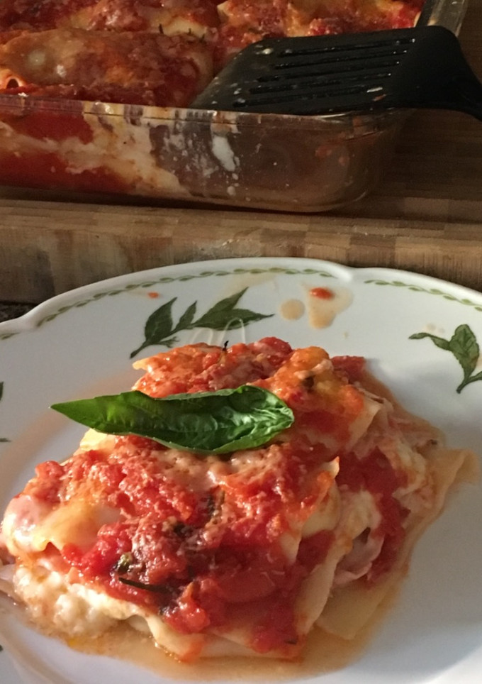 Una foto de Lasagna jamón, muzarela y champiñones