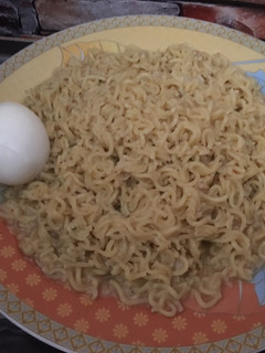A picture of Noodles with boiled egg.