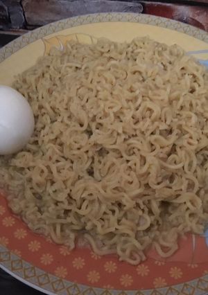 A picture of Noodles with boiled egg.