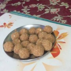 A picture of Almond sesame peanut laddu with jaggery.