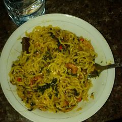A picture of Indomine with prawns and pumpkin leaves.