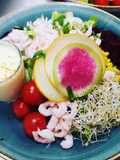 Shrimps salad served with sea-buckthorn berries dressing