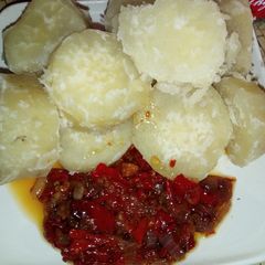 A picture of Boiled sweet potato with souce.