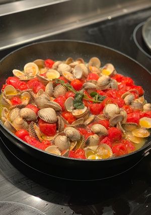 A picture of Cockles, mini tomatoes, pasta.