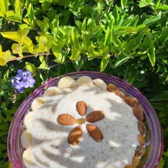 A picture of Oats kheer with lots of dry fruits.