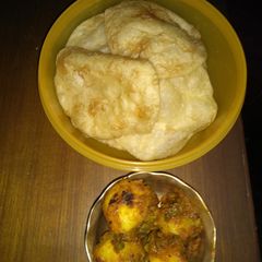 Luchi aaloor Dom (Puri and dum aaloo) A picture of Luchi aaloor Dom (Puri and dum aaloo).