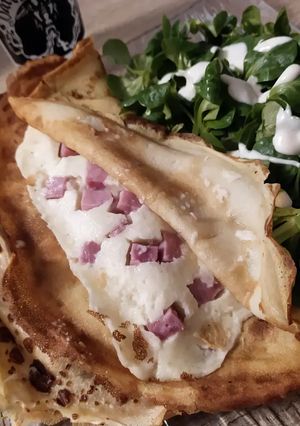 A picture of Savory Ham and Raclette Cheese Crêpes with Béchamel.
