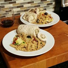 A picture of Steamed Pesto Chicken Rolls with Whole Wheat Pasta.