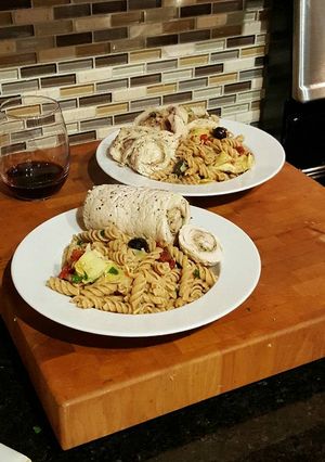 A picture of Steamed Pesto Chicken Rolls with Whole Wheat Pasta.