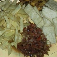 A picture of Fried yam,chips,fried plantain n sausage sauce.