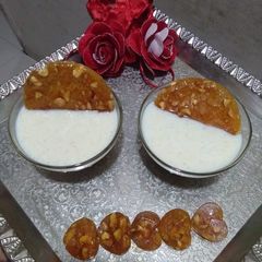 A picture of Rice kheer with caramelized nuts.