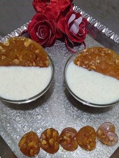 A picture of Rice kheer with caramelized nuts.