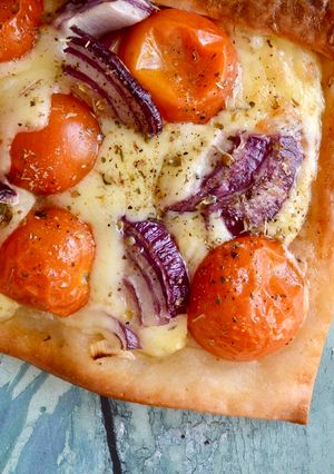 A picture of Tomato, Cheese and Onion Tarts.