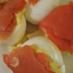 A picture of Deviled eggs and lox.