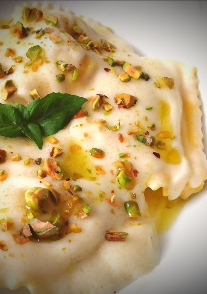 Una foto de Raviolis de Calabaza  a la crema de Grana Padano