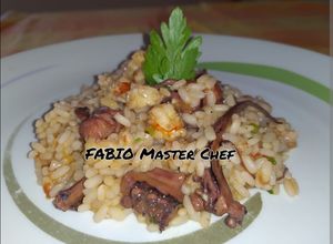 Foto di Risotto con Tentacoli di Totani e Gamberoni sfumati al Cognac