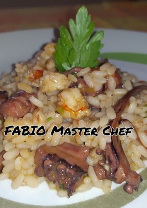 A picture of Risotto with Squid Tentacles and Prawns Flambéed with Cognac.