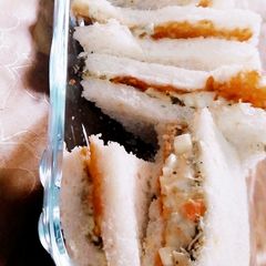 A picture of Chicken and vegi sandwiches.