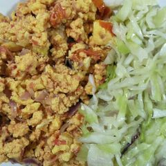 A picture of Scrambled eggs with cabbage.