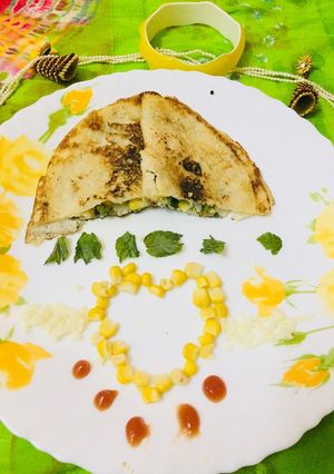 A picture of Corn spinach cheesy dosa.