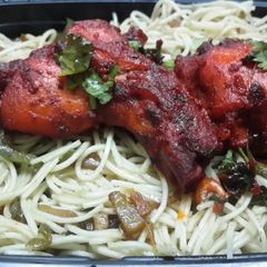 A picture of Prawn and mixed veg chowmein with tandoori chicken.