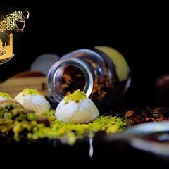 A picture of Maamoul cookies with pistachio, walnuts, and dates.
