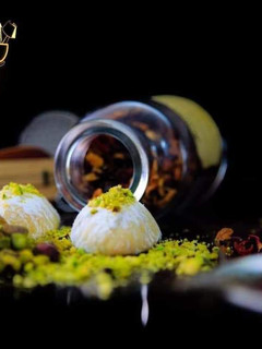 A picture of Maamoul cookies with pistachio, walnuts, and dates.