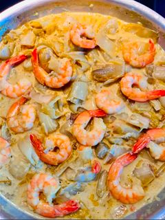 Una foto de Curry de endibias y gambas