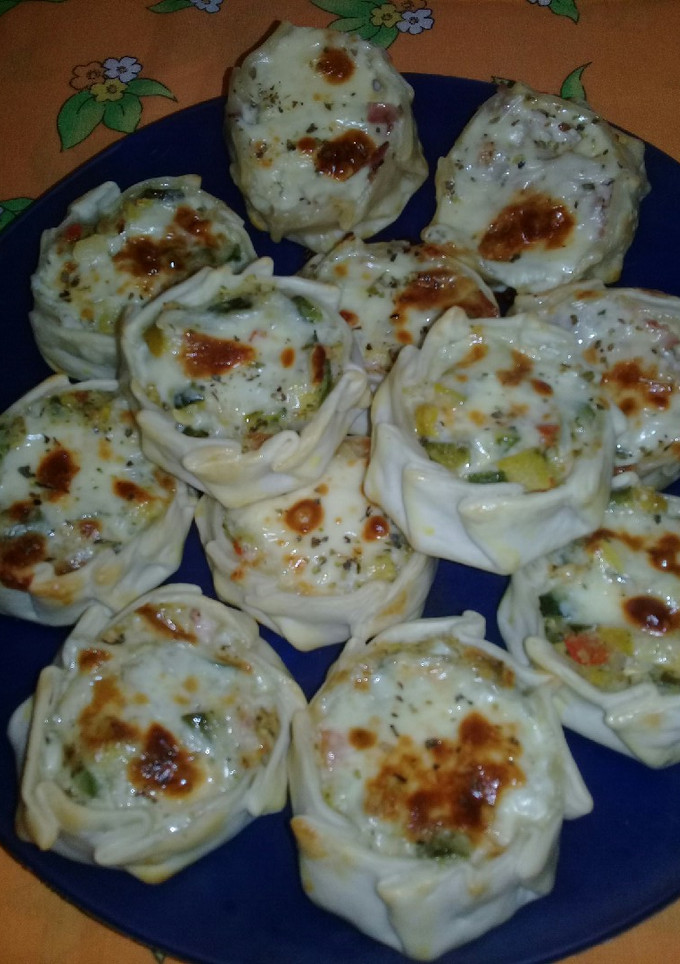Una foto de Canastitas de cebolla, queso y zapallito. 😄😋