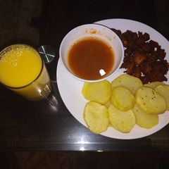 Deep fried potatoes with fried meat n passion juice A picture of Deep fried potatoes with fried meat n passion juice.