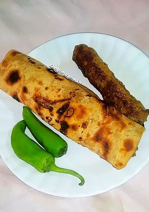 A picture of Seekh kabab roll paratha.