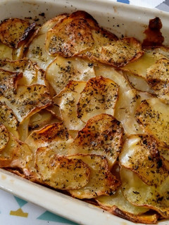 Una foto de Papas laminadas al horno