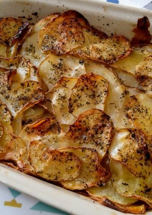 Una foto de Papas laminadas al horno