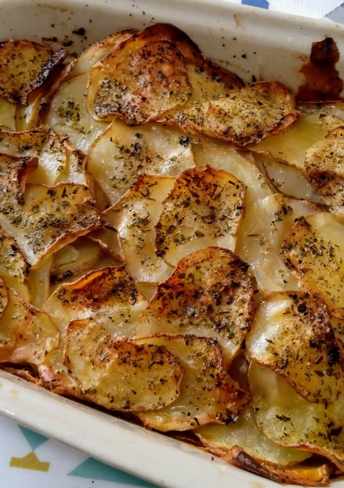 Una foto de Papas laminadas al horno