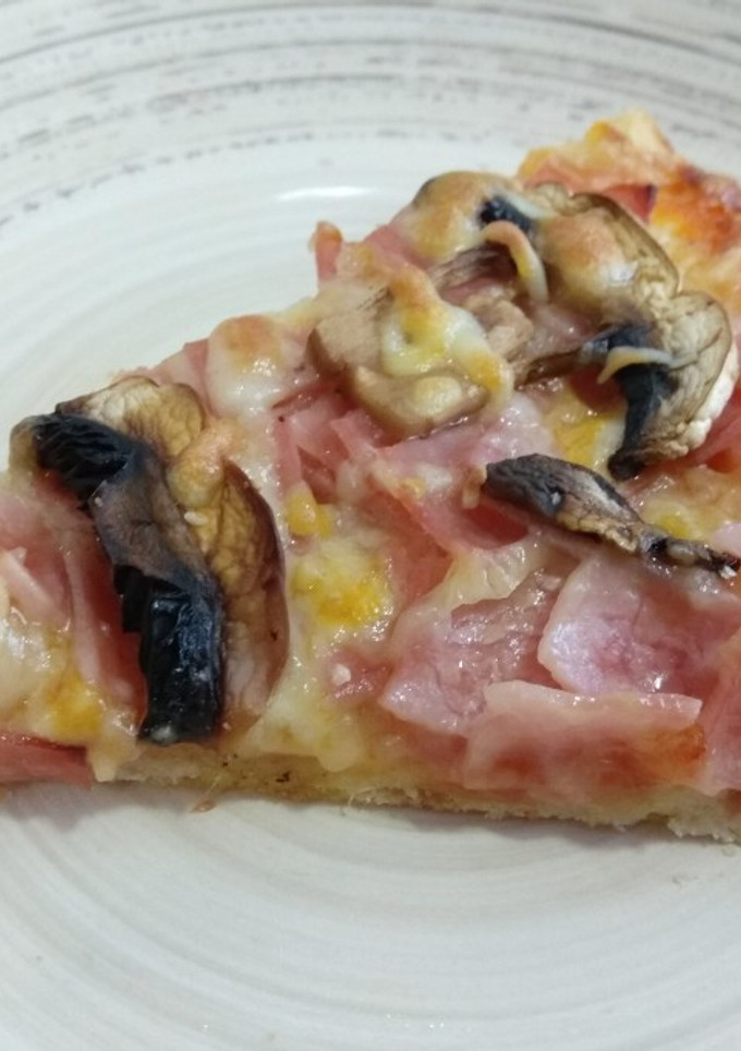 Una foto de Pizza york - queso con champiñones naturales